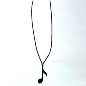 Long necklace with music note pendant
